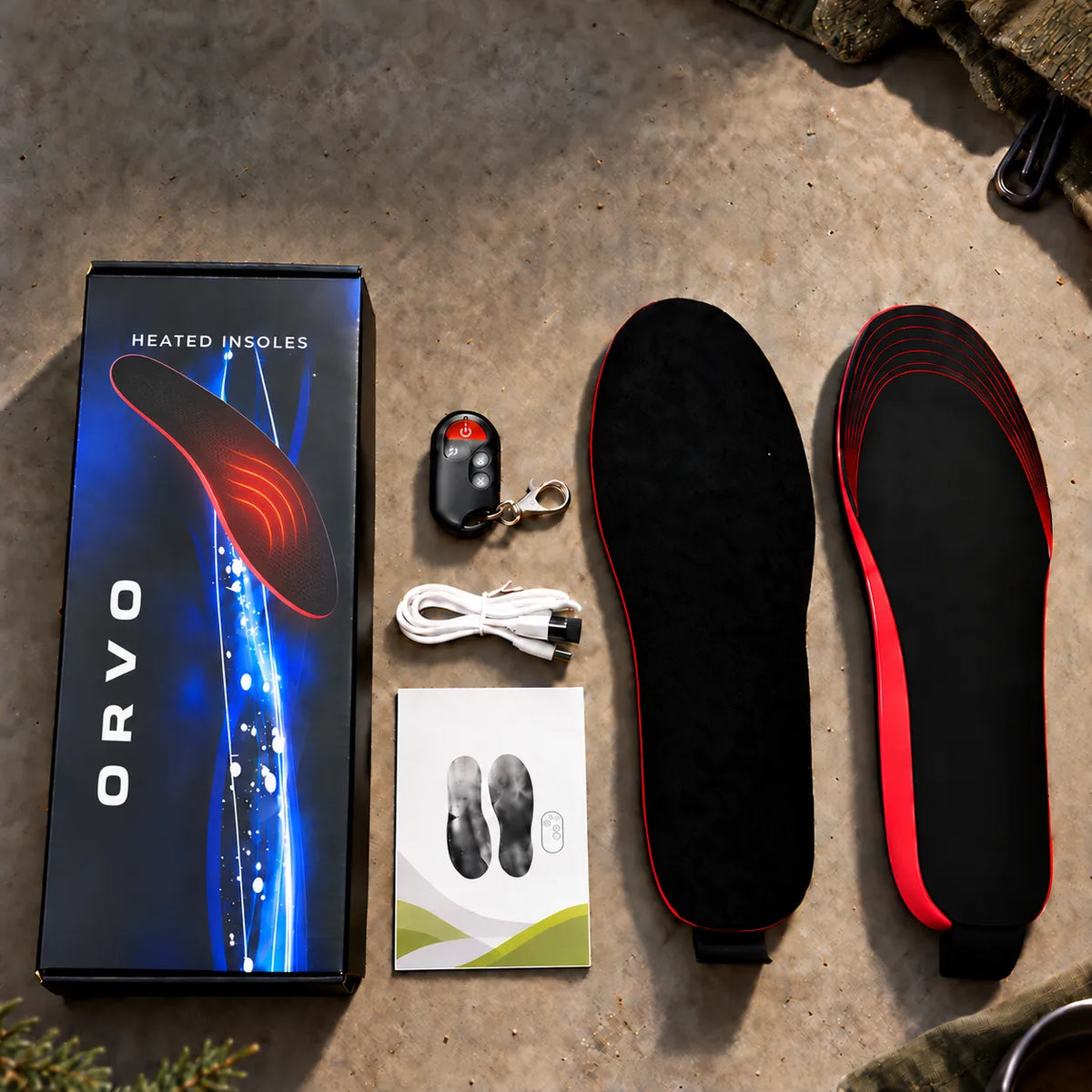 ORVO värmesulor i presentkartong med ett par sulor, fjärrkontroll med nyckelring, USB-kabel och bruksanvisning